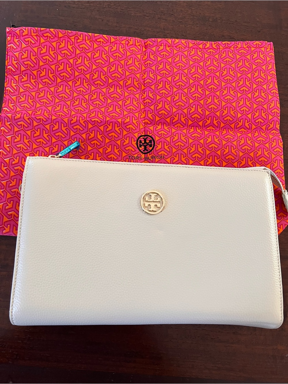 T B NWOT Beige Leatherette Clutch or Crossbody with Gold Logo and Gold chain.